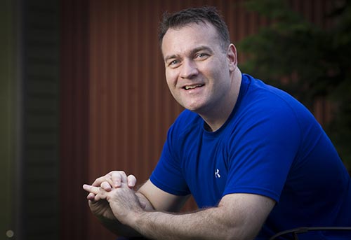 A man in a blue shirt.