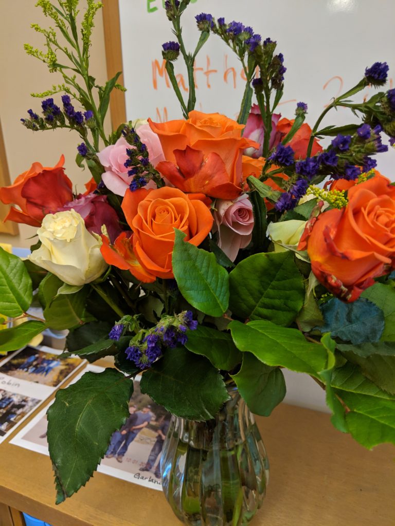 A vase full of brightly colored flowers