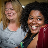 Two women smiling at the camera